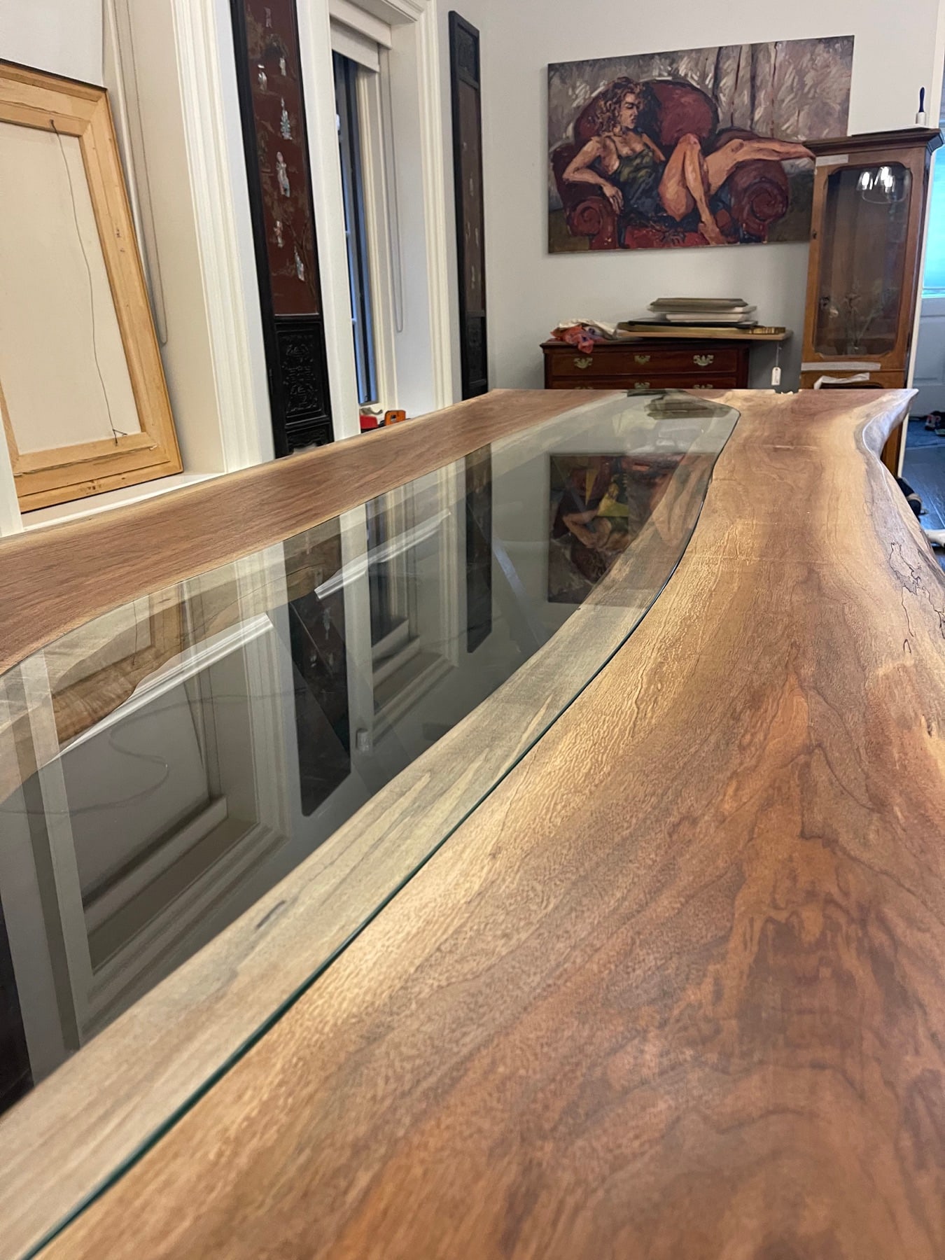 Live-edge wood table with an inset glass centre